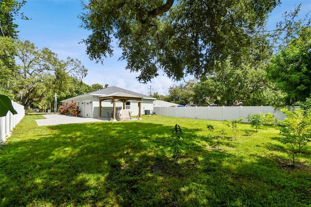 view of yard featuring central AC unit and a patio area