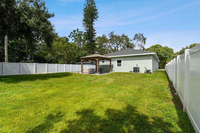 view of yard featuring a gazebo, cooling unit, and a patio