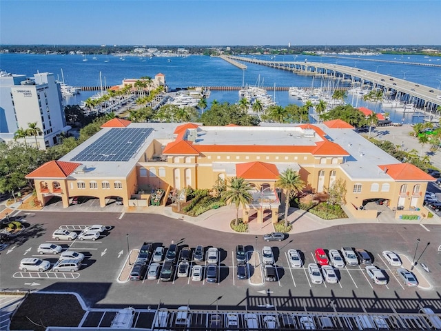 birds eye view of property with a water view