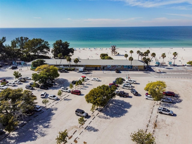 bird's eye view featuring a beach view and a water view