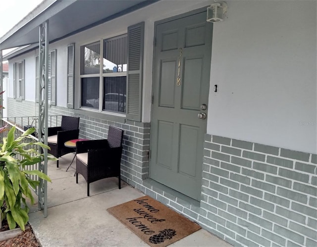 doorway to property with a porch