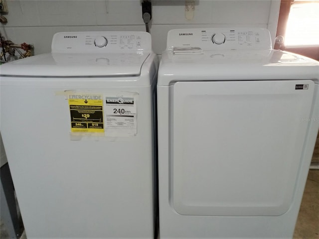 washroom featuring independent washer and dryer