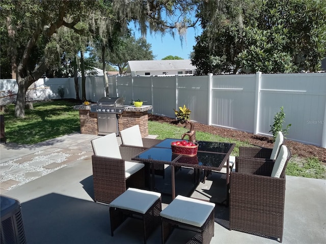 view of patio featuring area for grilling and exterior kitchen