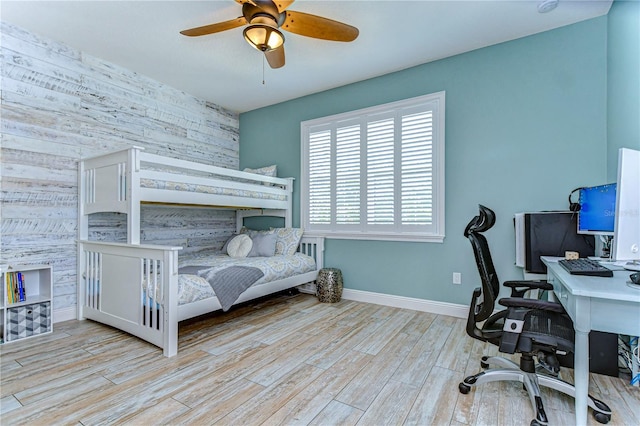 bedroom featuring light hardwood / wood-style floors and ceiling fan