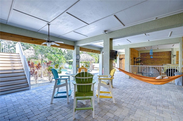 view of patio featuring ceiling fan