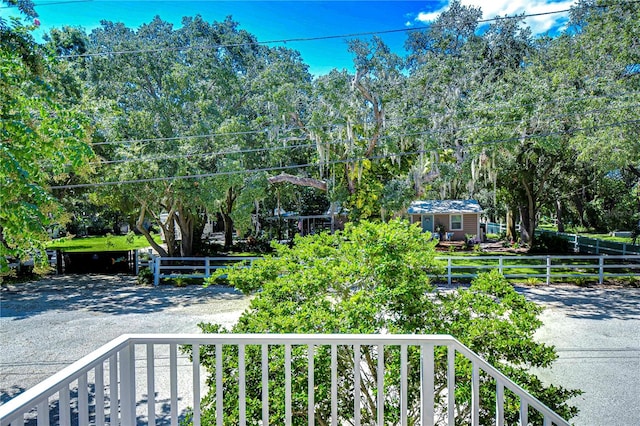 view of yard with a balcony