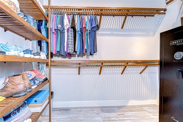 spacious closet featuring light hardwood / wood-style floors