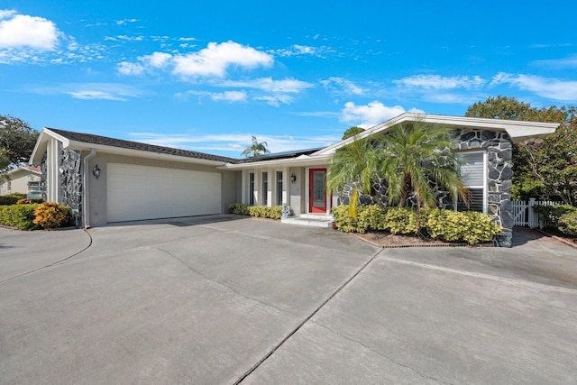 ranch-style house featuring a garage