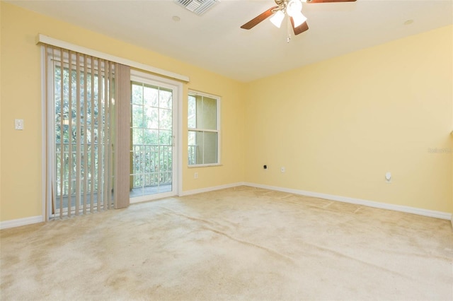 carpeted empty room with ceiling fan