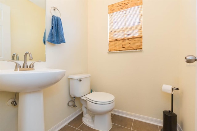 bathroom featuring tile patterned floors and toilet