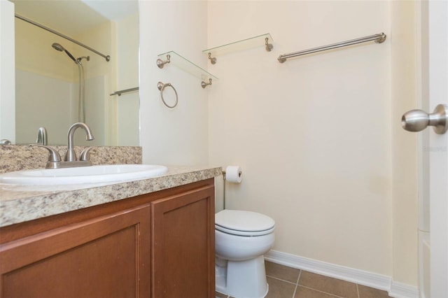 full bathroom with shower / tub combination, vanity, tile patterned flooring, and toilet