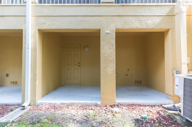 doorway to property with central AC