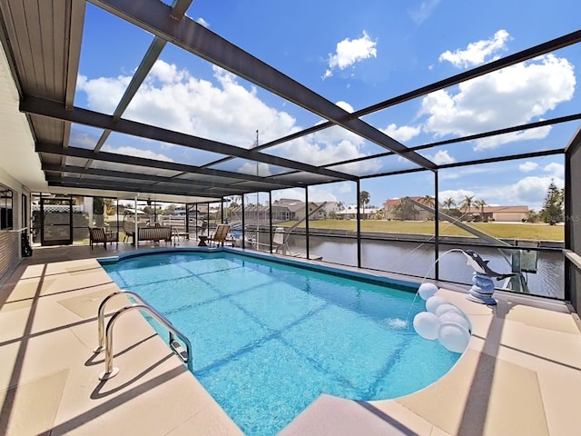 view of pool featuring a water view, a lanai, and a patio area