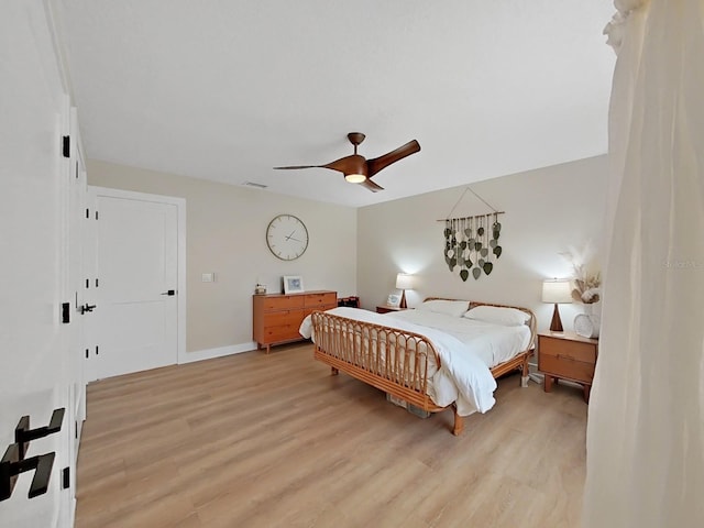 bedroom featuring ceiling fan and light hardwood / wood-style floors