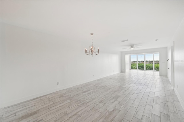 unfurnished room featuring light wood-type flooring and ceiling fan with notable chandelier