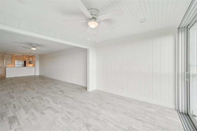 empty room featuring light wood-type flooring and ceiling fan