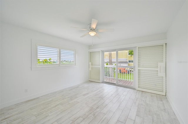 spare room with light hardwood / wood-style floors and ceiling fan