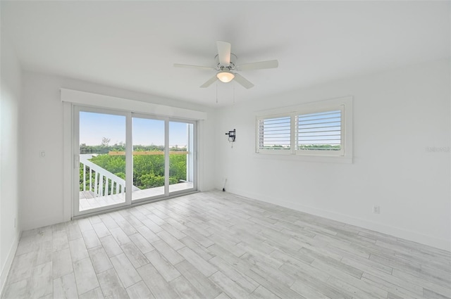 unfurnished room featuring light hardwood / wood-style floors and ceiling fan