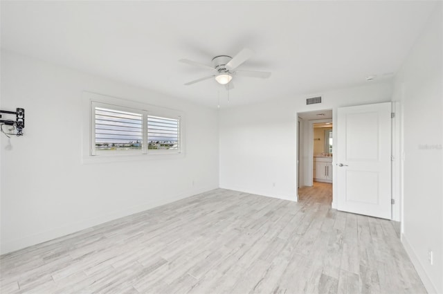 unfurnished room with light wood-type flooring and ceiling fan