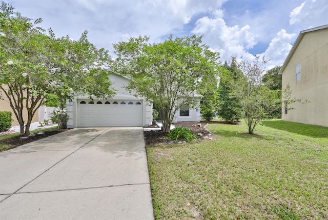 view of front of house featuring a front lawn and a garage