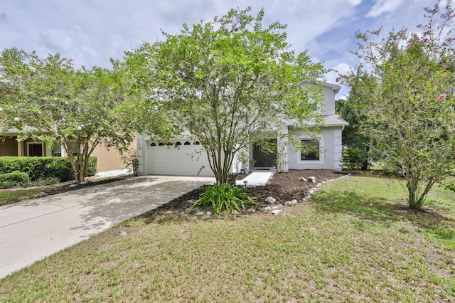 obstructed view of property featuring a garage and a front lawn