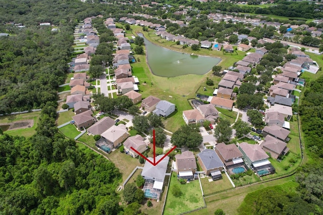 birds eye view of property with a water view