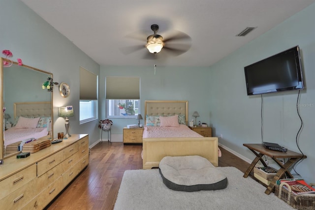 bedroom featuring dark hardwood / wood-style floors and ceiling fan