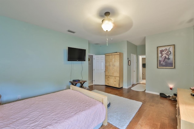 bedroom with ceiling fan and light hardwood / wood-style floors