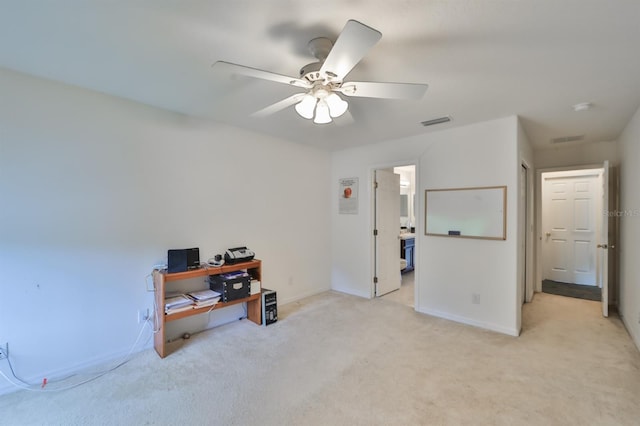 interior space featuring light carpet and ceiling fan