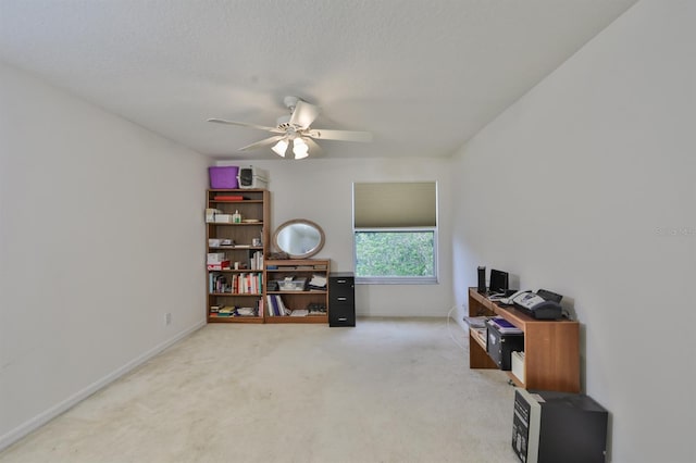 miscellaneous room featuring ceiling fan, carpet flooring, and a textured ceiling