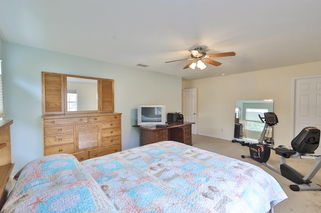 bedroom with light carpet and ceiling fan