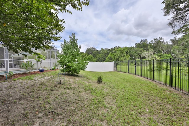 view of yard with a lanai