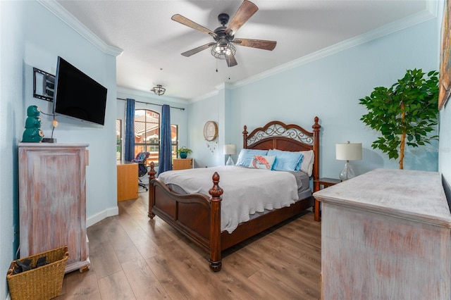 bedroom with ceiling fan, light wood-type flooring, and crown molding