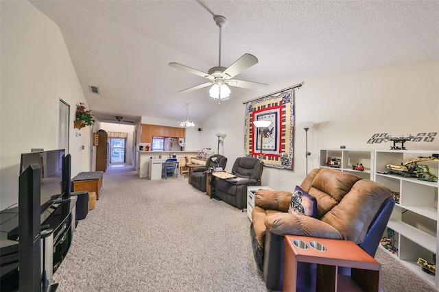 carpeted living room with a textured ceiling, lofted ceiling, and ceiling fan