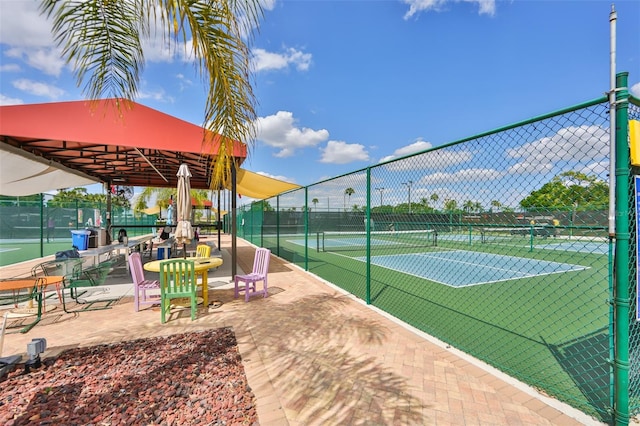 view of tennis court with a gazebo