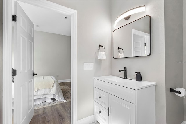 bathroom featuring hardwood / wood-style floors and vanity