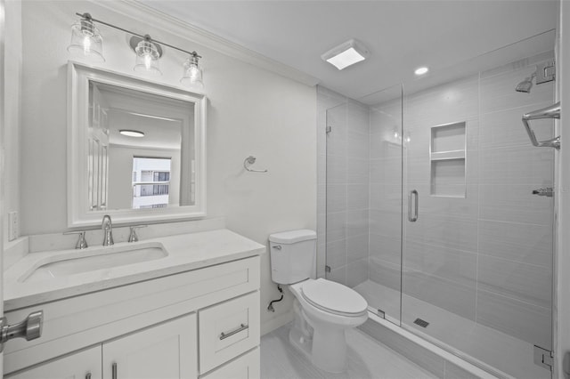 bathroom featuring vanity, toilet, and a shower with shower door