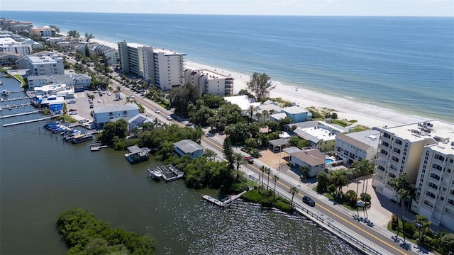 birds eye view of property with a view of the beach and a water view