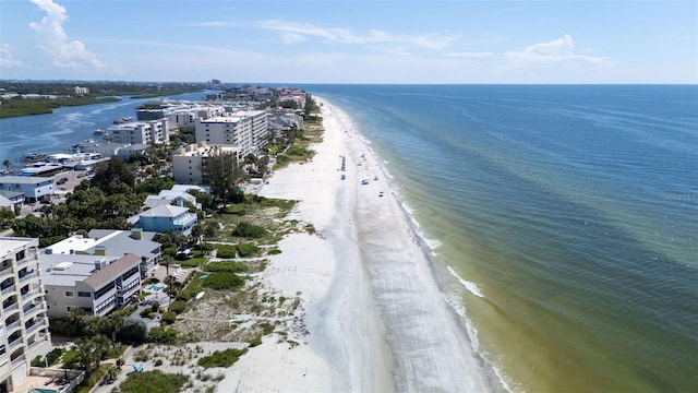 birds eye view of property featuring a beach view and a water view