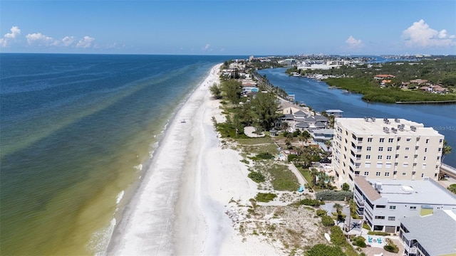 drone / aerial view featuring a beach view and a water view