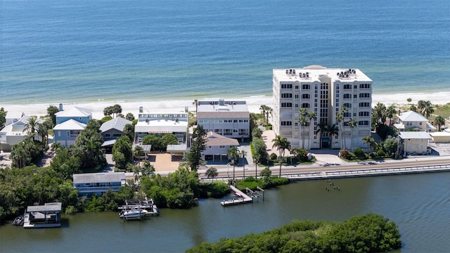 bird's eye view featuring a view of the beach and a water view