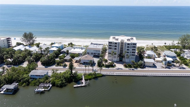 bird's eye view featuring a view of the beach and a water view