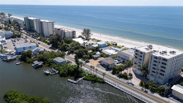 drone / aerial view featuring a view of the beach and a water view