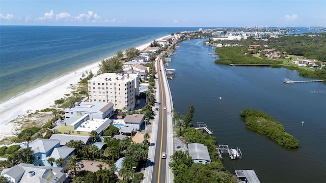 drone / aerial view with a beach view and a water view