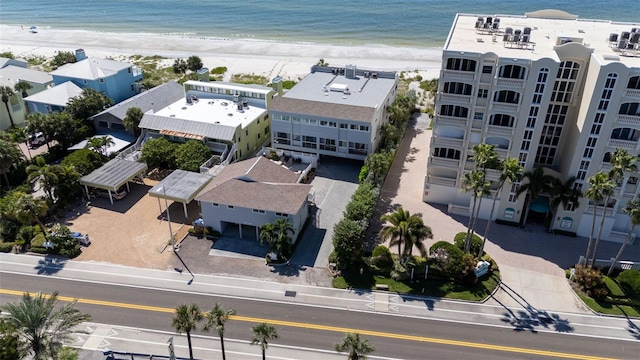 drone / aerial view with a beach view and a water view