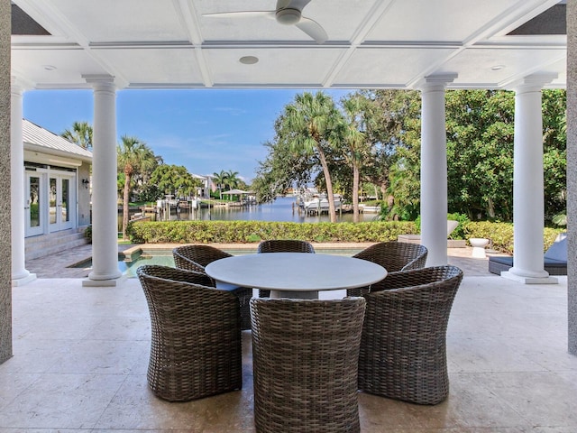 2509 N Dundee St, Tampa, FL 33629 - view of patio featuring french doors, ceiling fan, a water view, an outdoor pool, and outdoor dining area