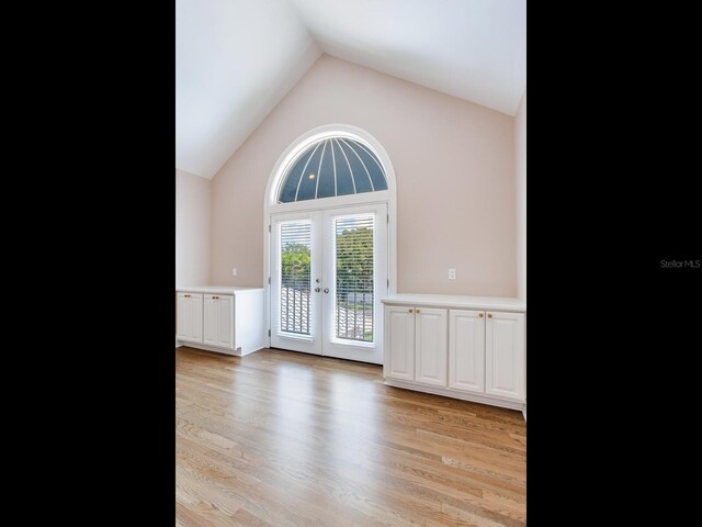 2509 N Dundee St, Tampa, FL 33629 - unfurnished room with french doors, light wood-type flooring, and high vaulted ceiling