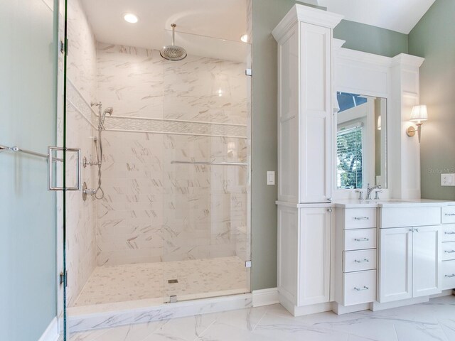 2509 N Dundee St, Tampa, FL 33629 - bathroom featuring a marble finish shower, vanity, marble look tiles, recessed lighting, and baseboards