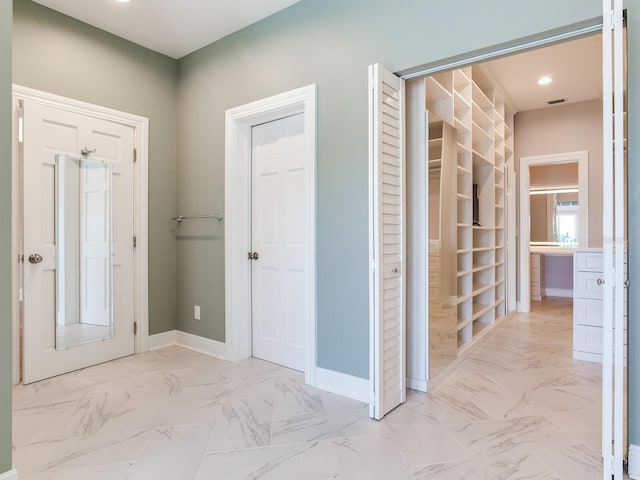 2509 N Dundee St, Tampa, FL 33629 - entrance foyer featuring light marble finish flooring, baseboards, and recessed lighting