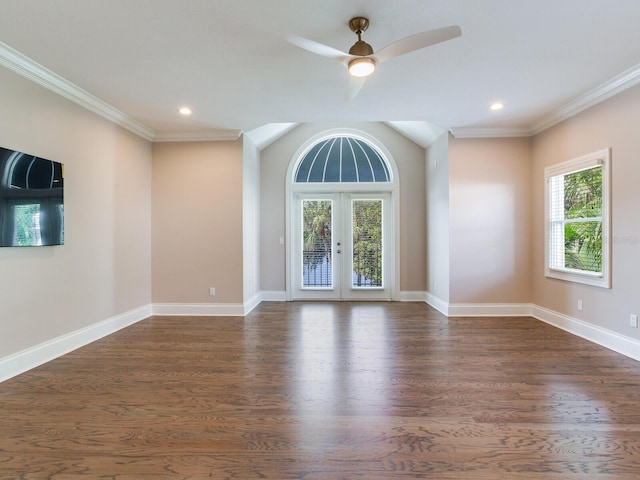 empty room with a wealth of natural light, french doors, and dark hardwood / wood-style flooring